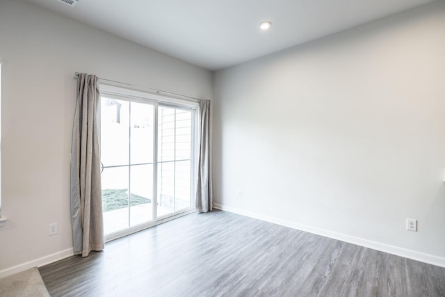 spare room featuring hardwood / wood-style flooring