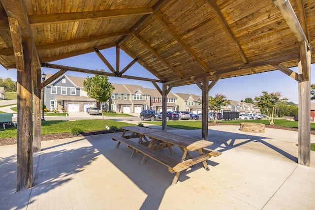 view of patio with a garage and a gazebo