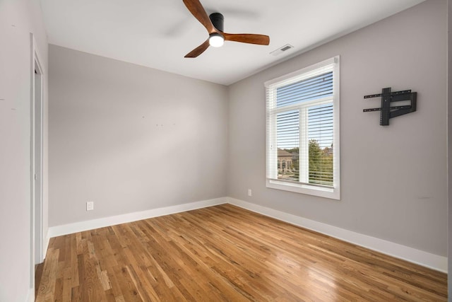 empty room featuring hardwood / wood-style floors and ceiling fan