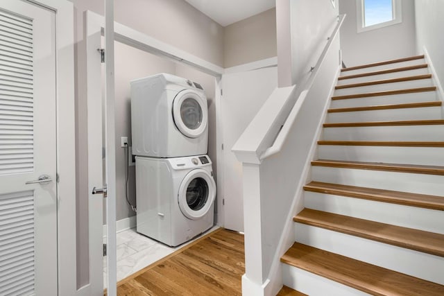 laundry room featuring stacked washing maching and dryer