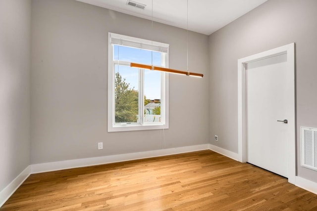 spare room featuring hardwood / wood-style floors