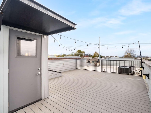 wooden terrace featuring central AC unit