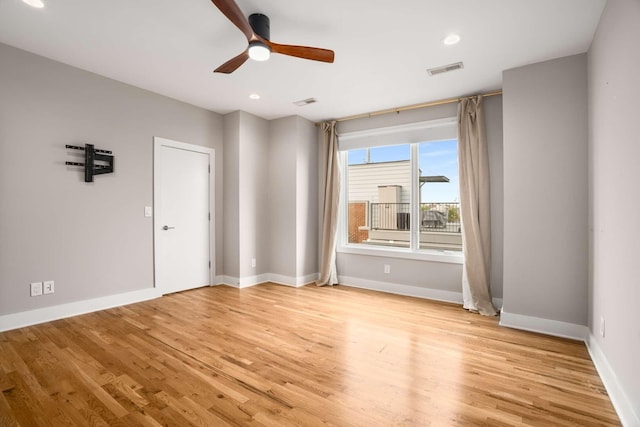 spare room with ceiling fan and light hardwood / wood-style flooring