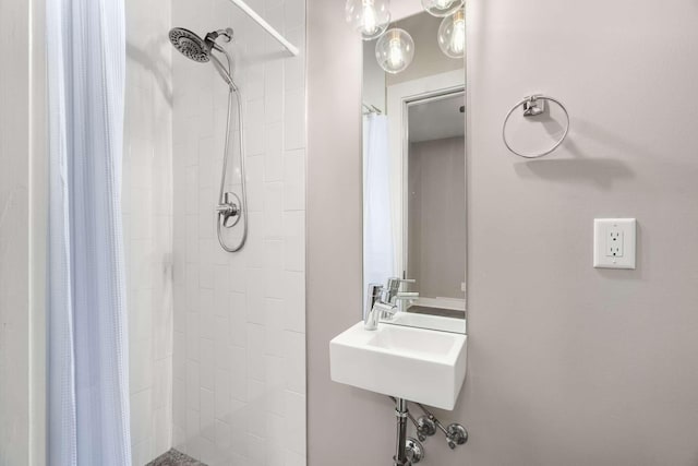 bathroom with sink and walk in shower