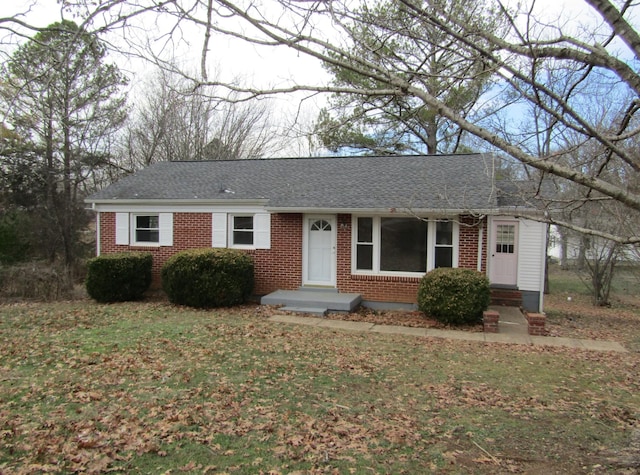 ranch-style home with a front lawn