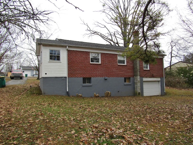 back of property featuring a garage