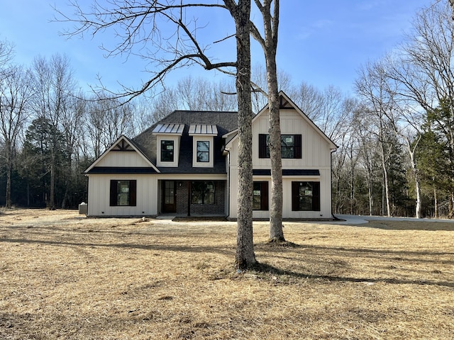 modern farmhouse with a front yard