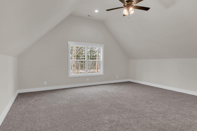 bonus room featuring lofted ceiling, carpet flooring, and ceiling fan