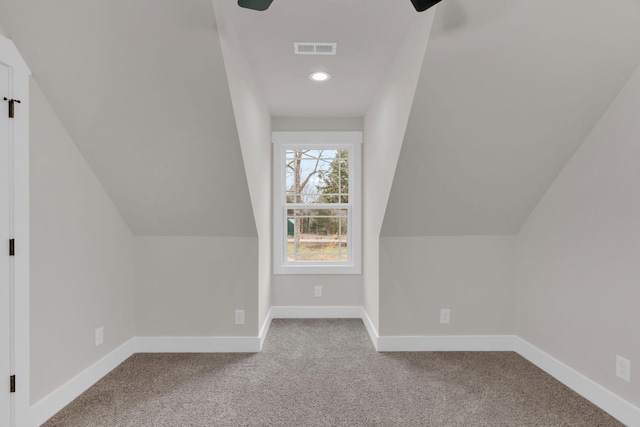 additional living space with lofted ceiling and carpet floors