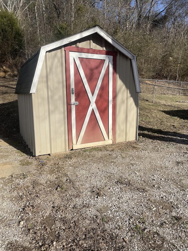 view of shed with fence