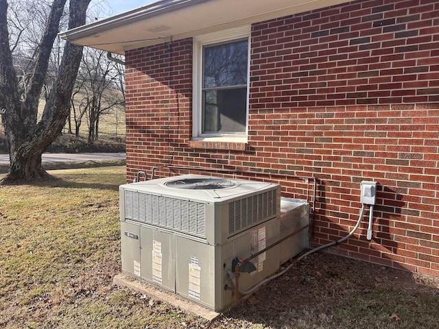 details with cooling unit and brick siding