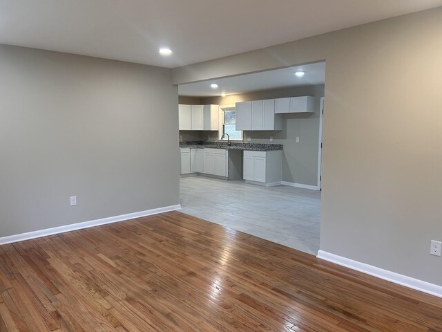 interior space with recessed lighting, baseboards, and light wood-type flooring