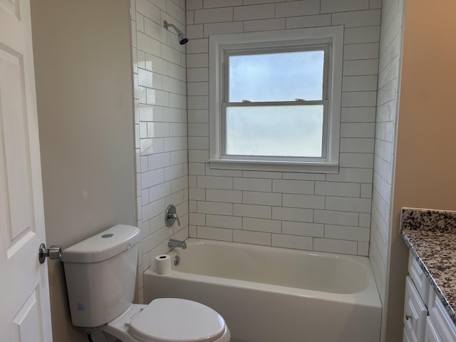 full bathroom featuring toilet, vanity, and  shower combination