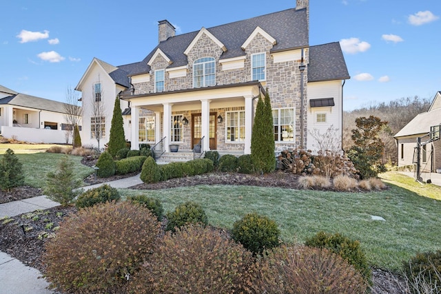 view of front of home featuring a porch and a front yard