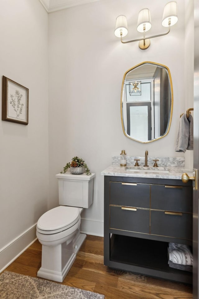 bathroom featuring hardwood / wood-style flooring, vanity, and toilet