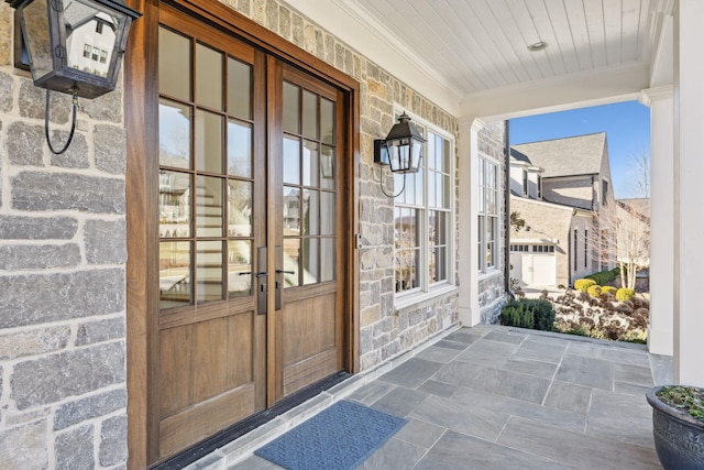 property entrance featuring french doors