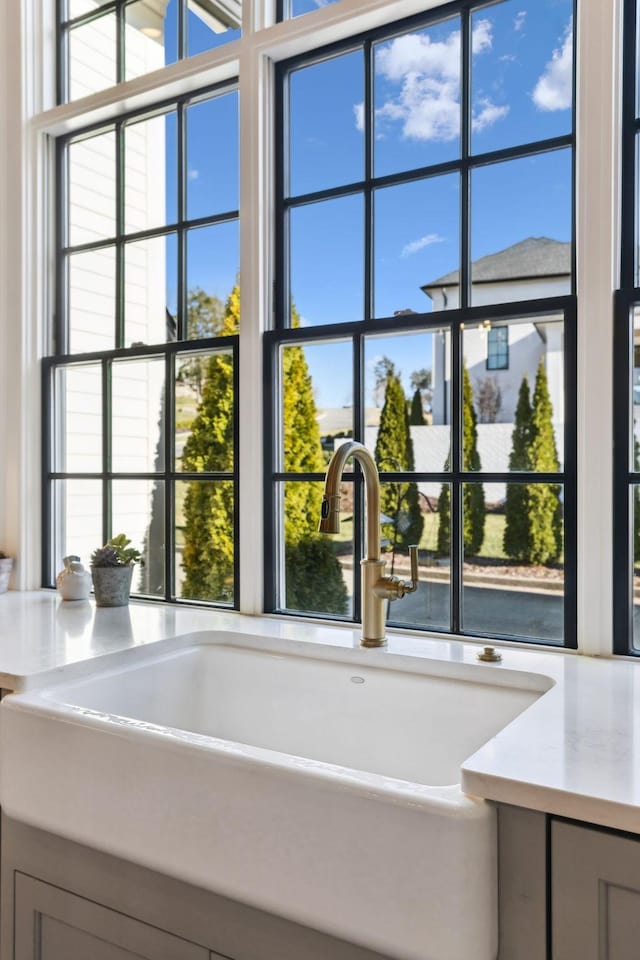 details with gray cabinets and sink