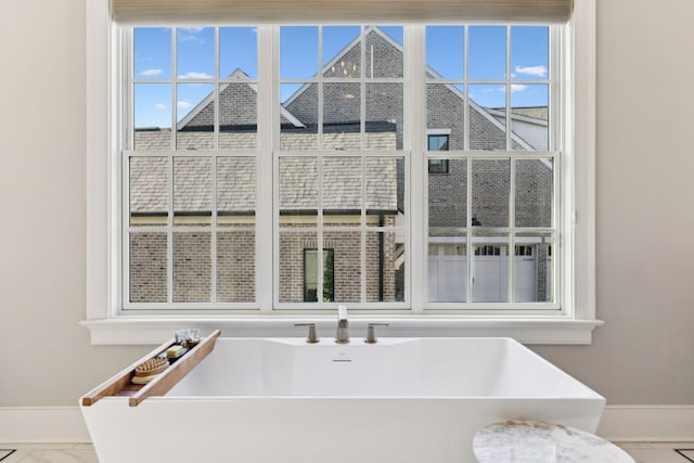 bathroom featuring a tub to relax in