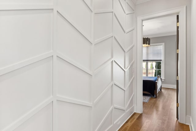 corridor with crown molding and dark hardwood / wood-style floors