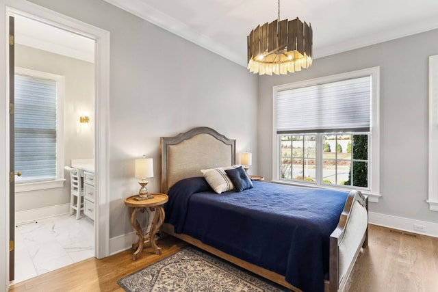 bedroom featuring hardwood / wood-style flooring and ornamental molding