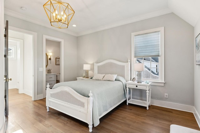 bedroom with lofted ceiling, connected bathroom, a notable chandelier, and dark wood-type flooring