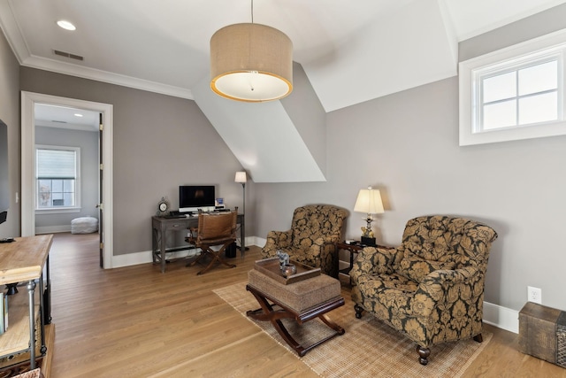 interior space with crown molding and light hardwood / wood-style floors