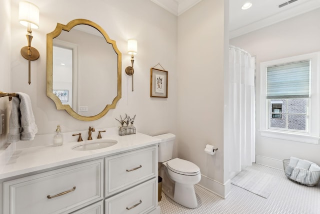 bathroom featuring ornamental molding, vanity, toilet, and tile patterned floors