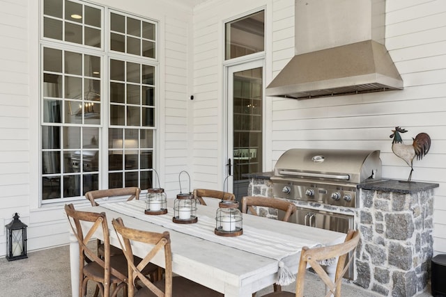 view of patio / terrace featuring an outdoor kitchen and a grill