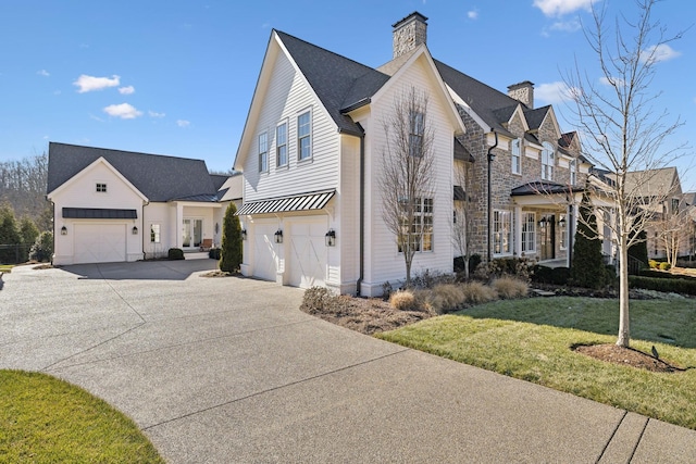 view of side of home with a lawn