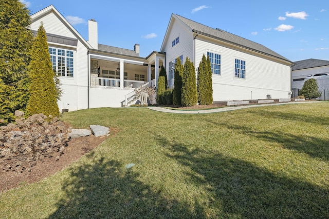 view of property exterior featuring ceiling fan and a yard