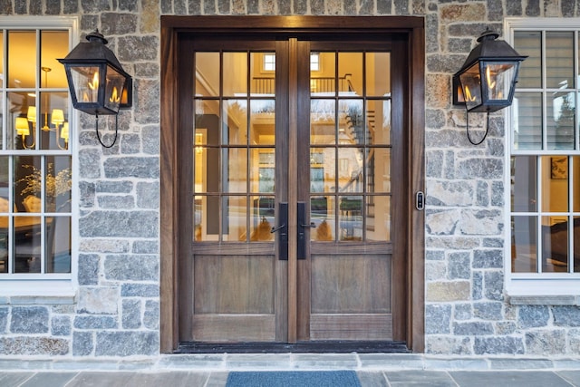 view of exterior entry featuring french doors