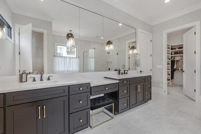 bathroom featuring ornamental molding, a shower with door, and vanity