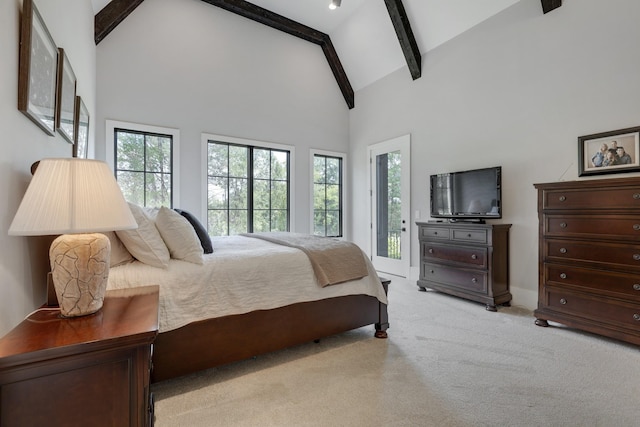 bedroom with beamed ceiling, light colored carpet, access to exterior, and high vaulted ceiling