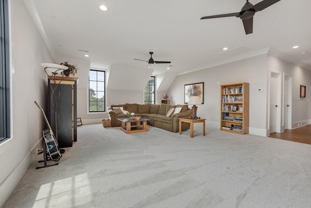 carpeted living room featuring crown molding and ceiling fan