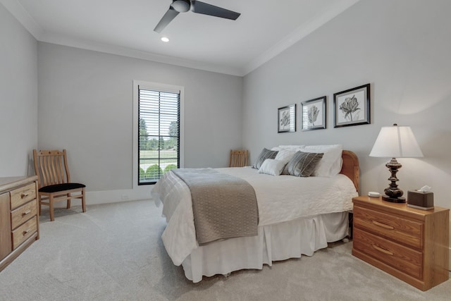 carpeted bedroom featuring ornamental molding and ceiling fan