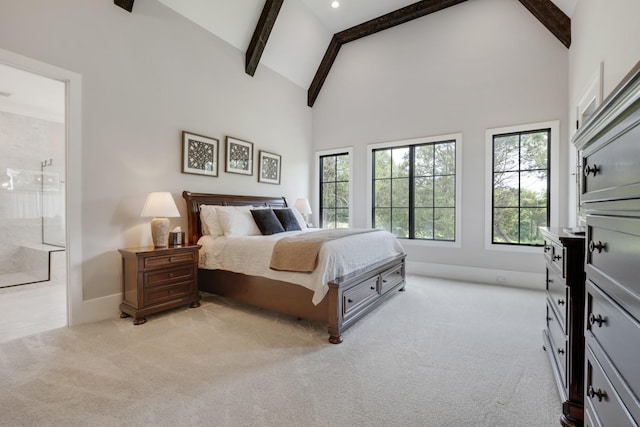 carpeted bedroom with beam ceiling and high vaulted ceiling