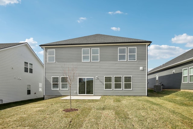 back of house featuring a yard, a patio area, and central air condition unit