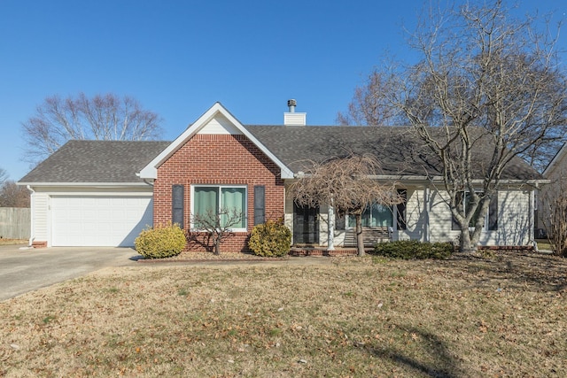 view of front of home featuring a garage and a front lawn