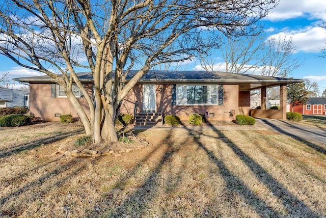 single story home with a carport and a front lawn