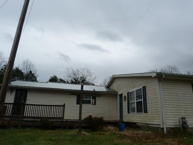 view of side of property featuring a deck