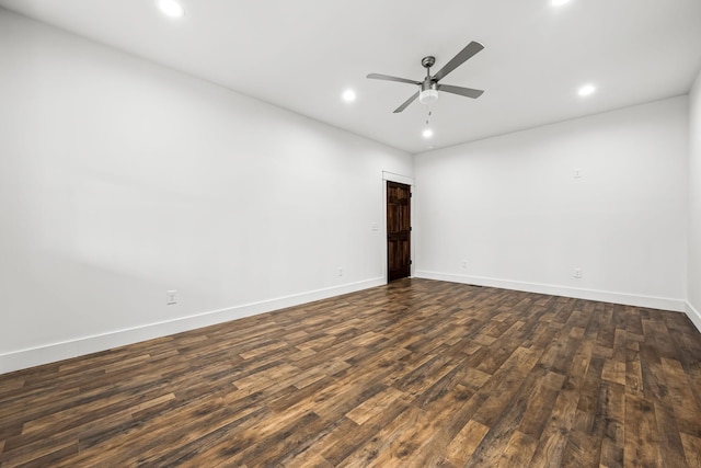 unfurnished room with dark wood-type flooring and ceiling fan