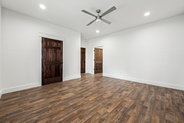 unfurnished bedroom featuring ceiling fan and dark hardwood / wood-style floors