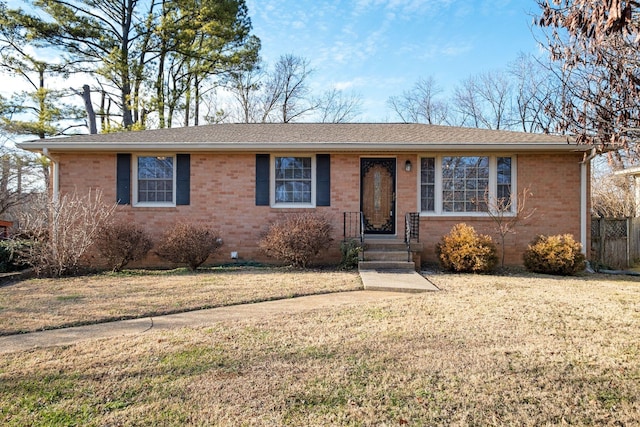 ranch-style home featuring a front lawn