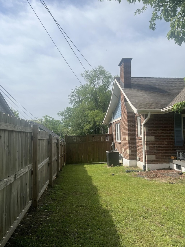 view of yard with central air condition unit