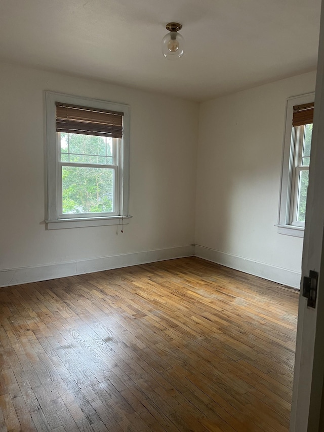 unfurnished room featuring light hardwood / wood-style flooring