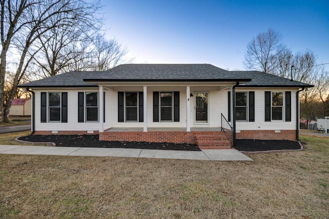 single story home featuring a front lawn and a porch