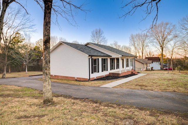 view of front of house with a yard