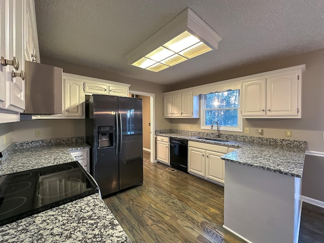 kitchen featuring sink, black dishwasher, stainless steel fridge with ice dispenser, and white cabinets