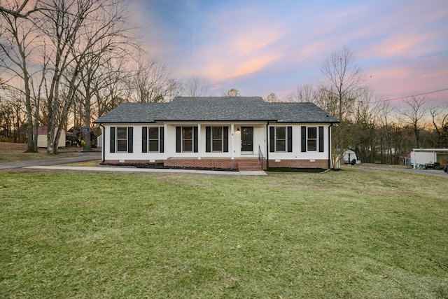 ranch-style house with a yard