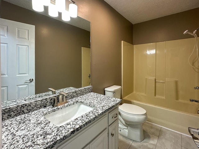 full bathroom featuring shower / washtub combination, toilet, a textured ceiling, and vanity